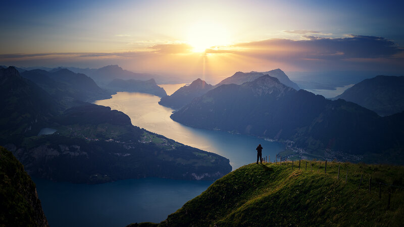 Person on Mountain Peak — Blue, Serene, Sunrise, Photograph, Mountains