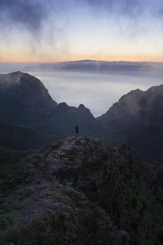Person on Mountain Peak — Blue, Serene, Sunrise, Photograph