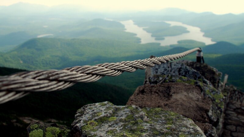 Person on Mountain Peak — Green, Serene, Morning, Photograph