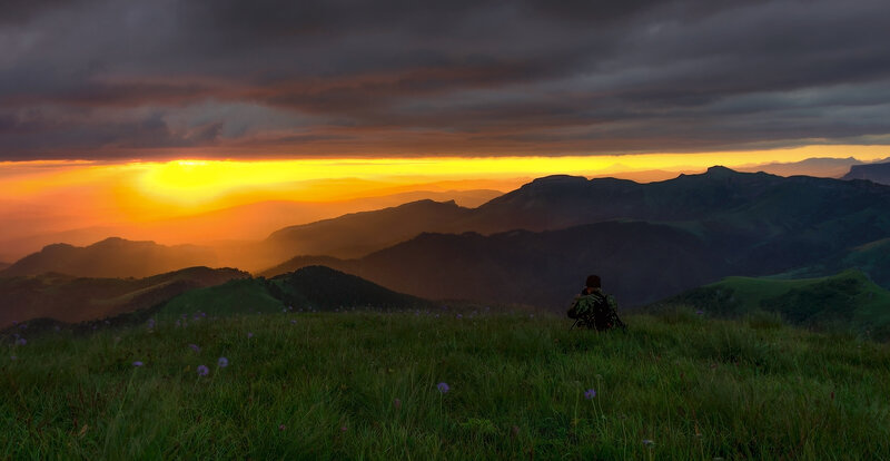 Person on Mountain Peak — Green