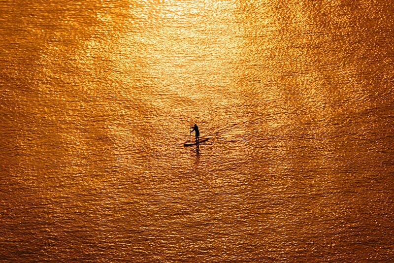 Person on Paddleboard — Gold, Serene