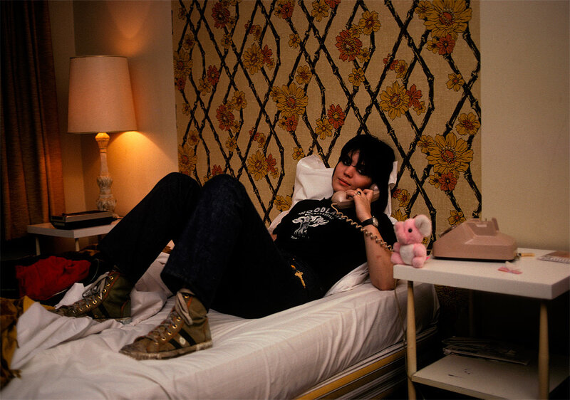 Person on phone in hotel room