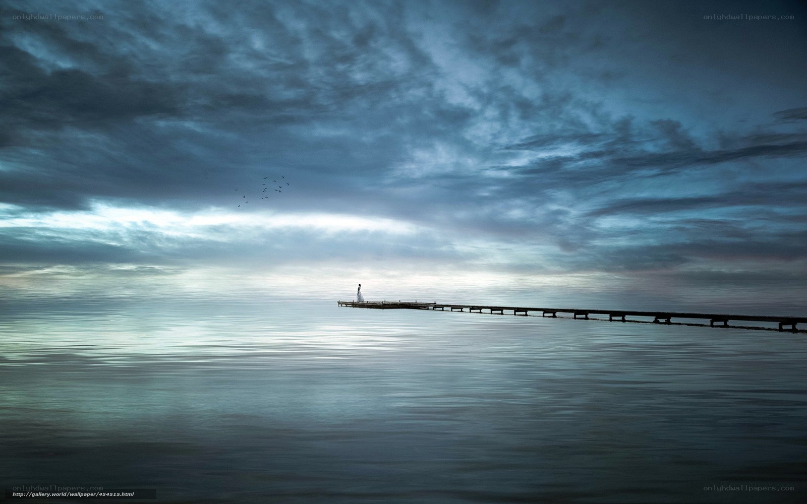 Person on pier at dusk