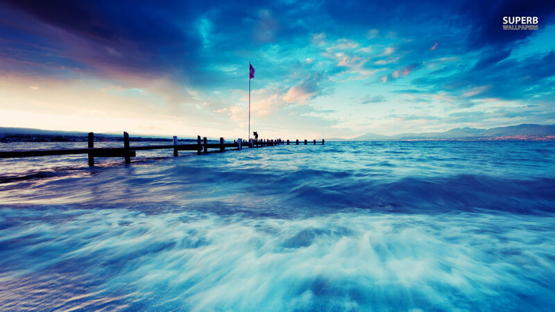 Person on Pier at Sunset — Blue