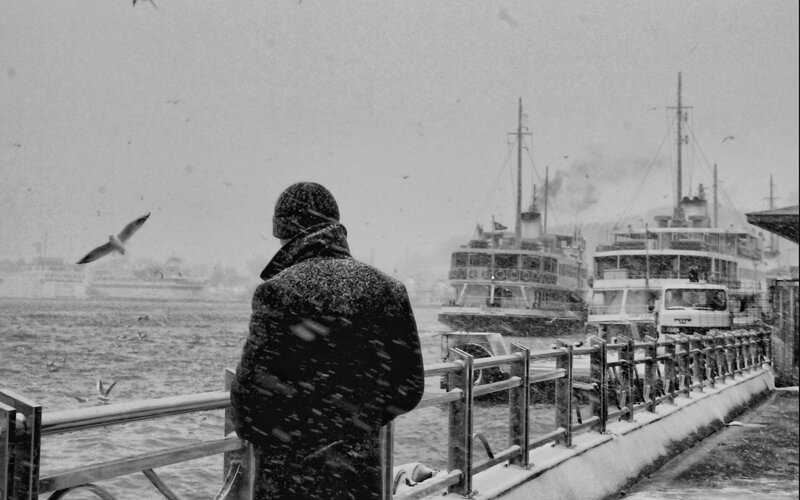 Person on Pier in Snow