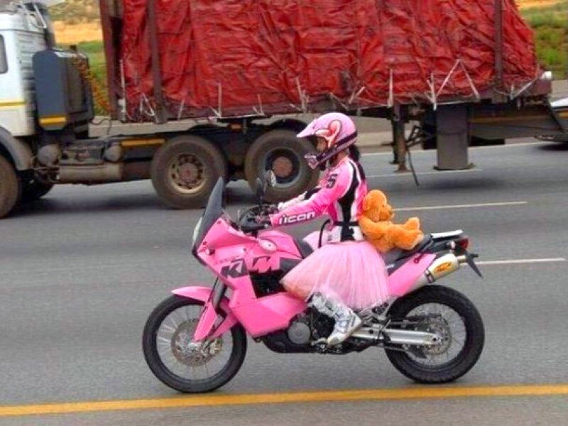 person on pink motorcycle