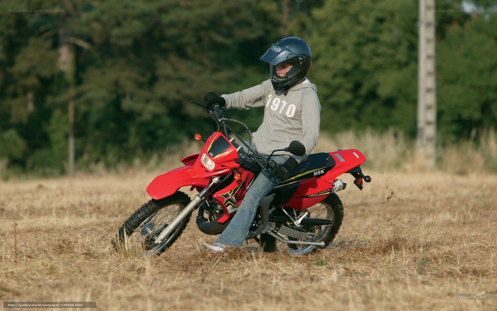 person on red dirt bike