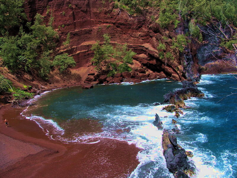 Person on Red Sand Beach