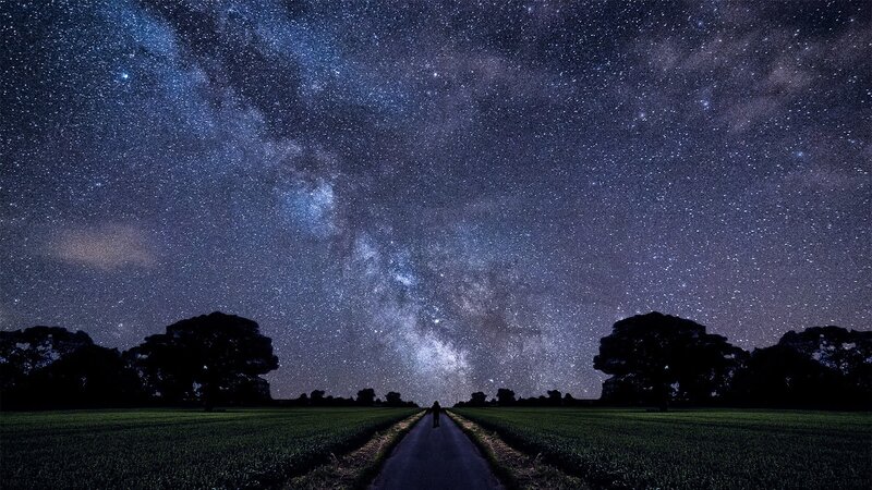 Person on Road under Stars