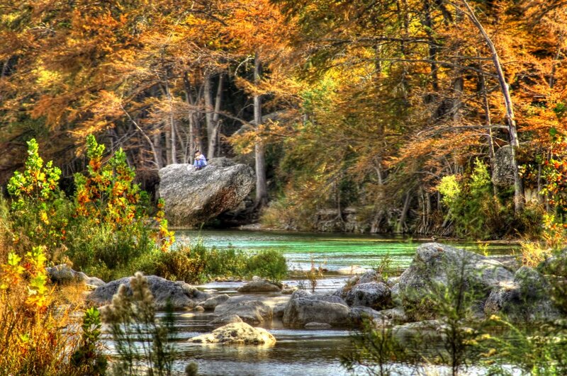 Person on Rock by River