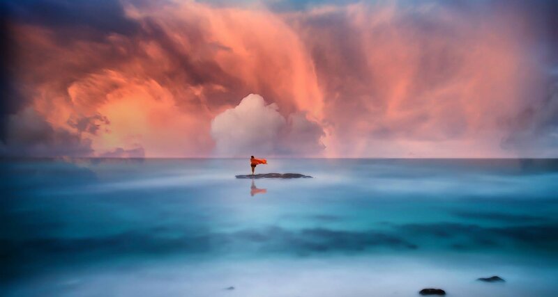 Person on Rock in Ocean