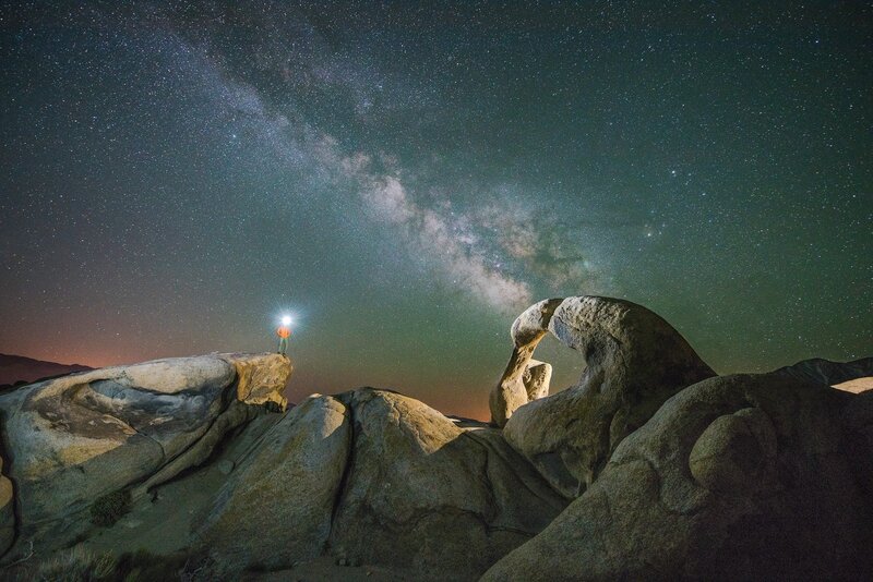 Person on Rock under Stars