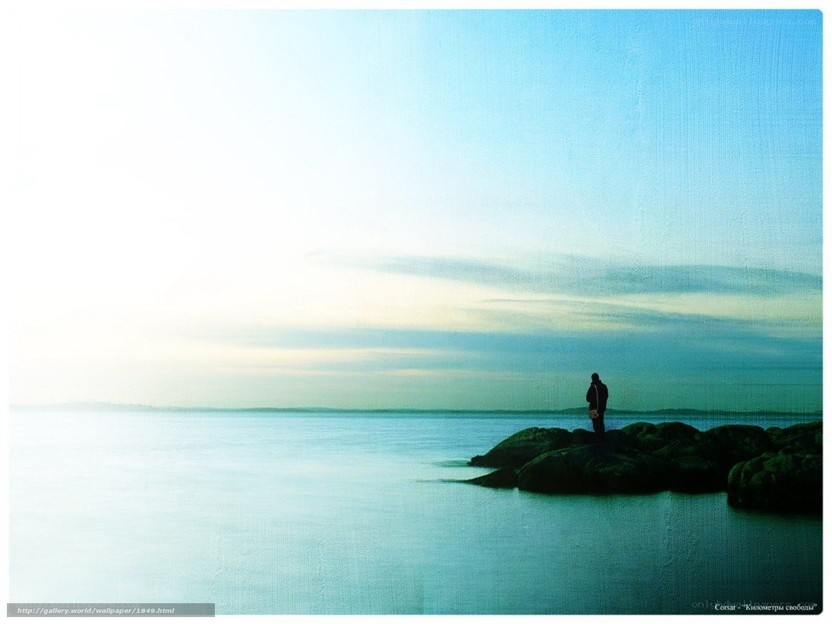 Person on rocks by the sea