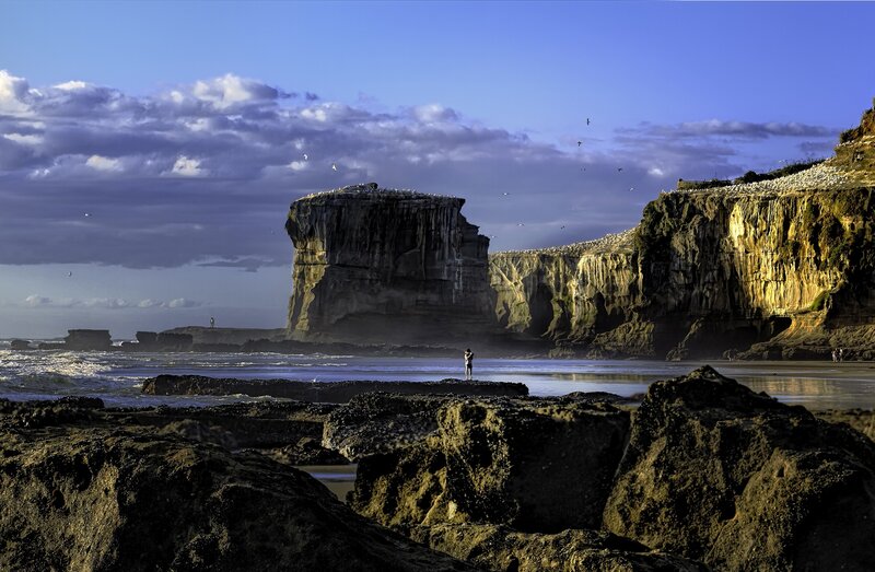 Person on Rocky Beach — Blue, Dramatic