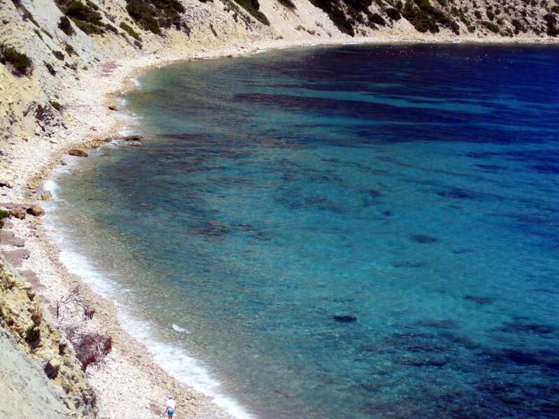 Person on Rocky Beach — Blue, Serene