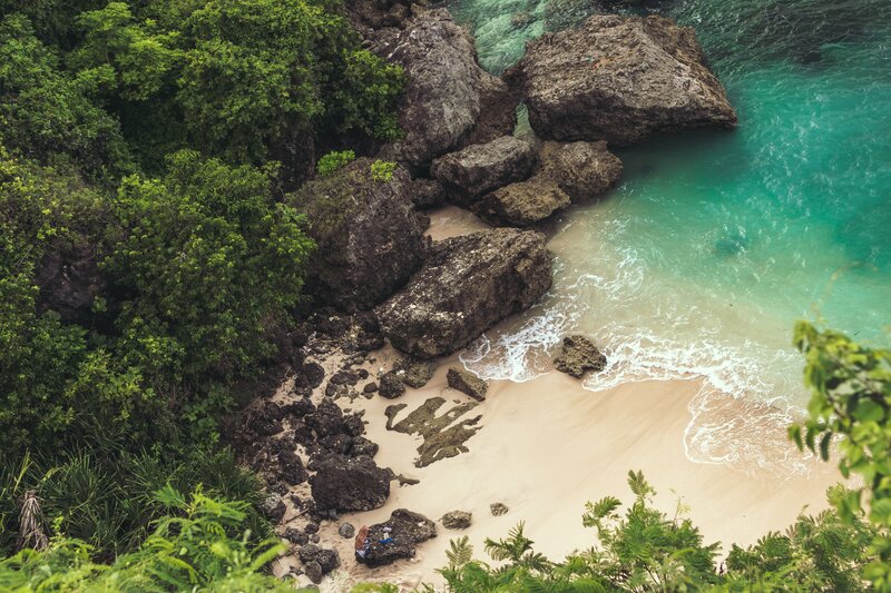 Person on Rocky Beach — Green