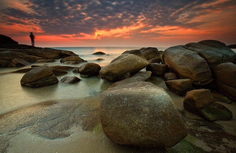 Person on Rocky Beach — Orange