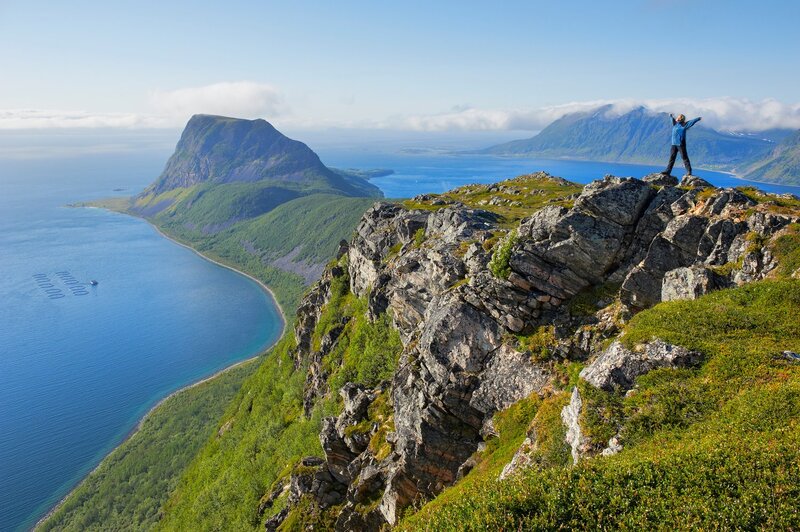 Person on Rocky Cliff — Blue, Serene, Afternoon