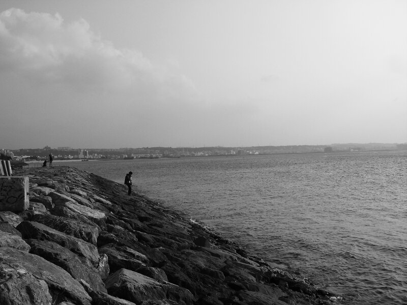 Person on Rocky Pier