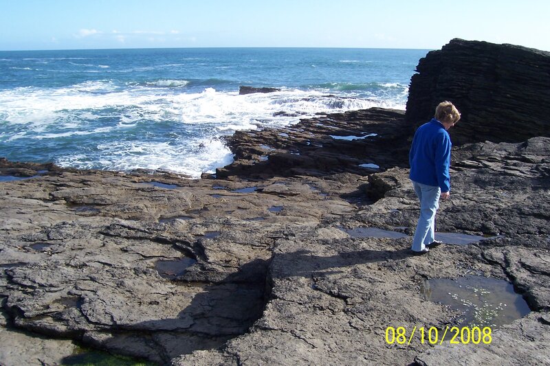 Person on Rocky Shore — Blue, Calm