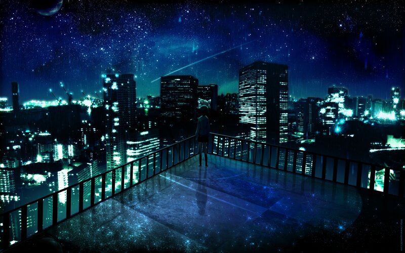 person on rooftop at night