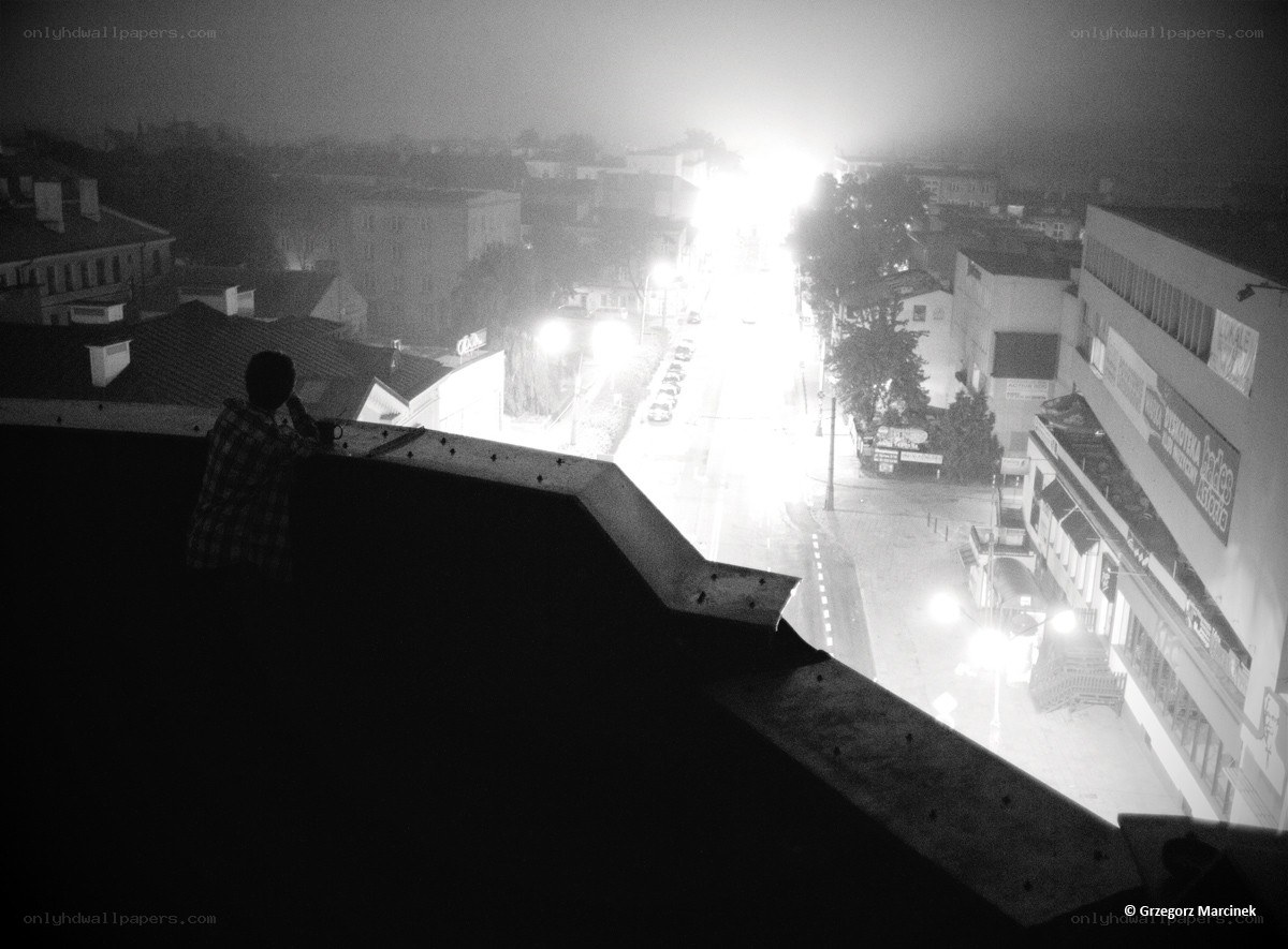 Person on rooftop at night