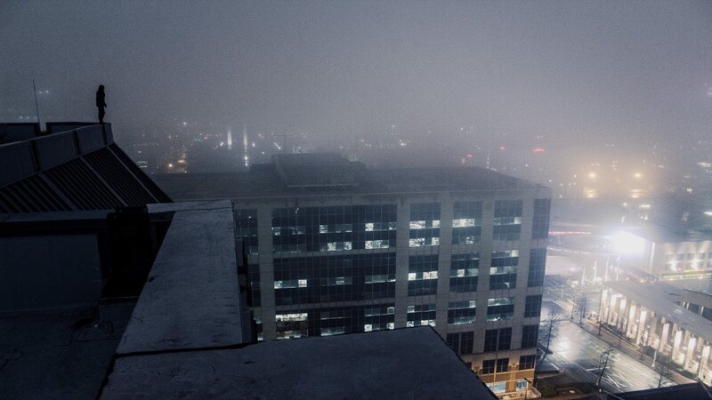 Person on Rooftop at Night — Gray