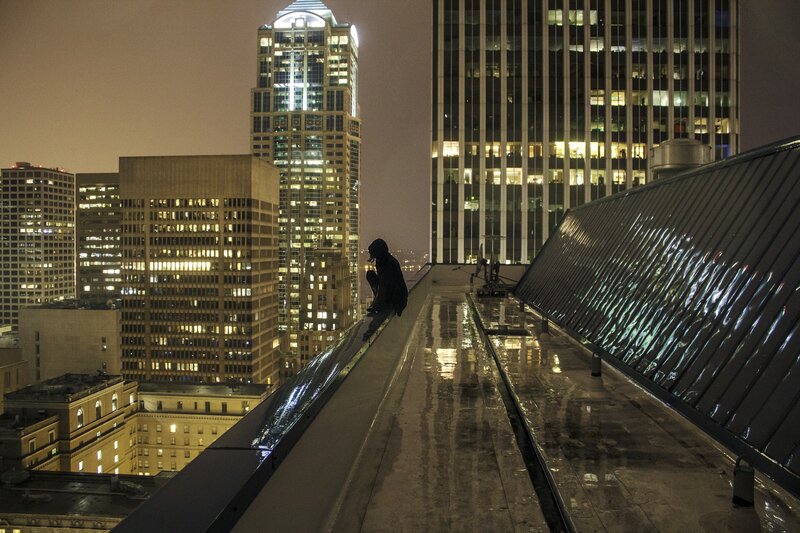 Person on Rooftop Edge — Black