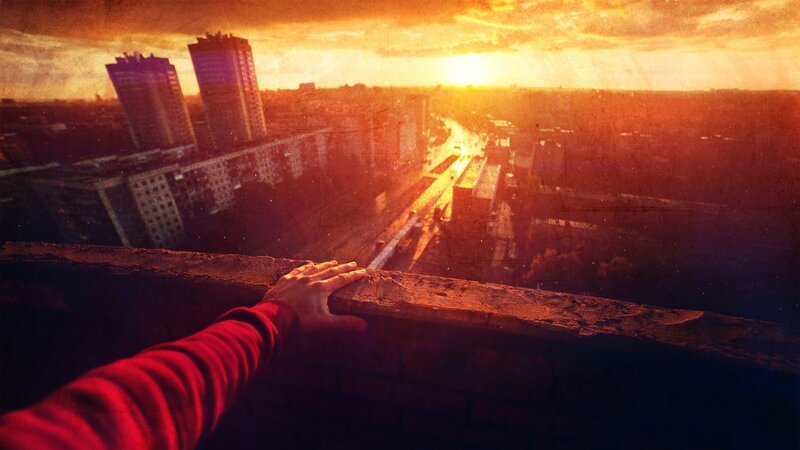 Person on Rooftop — Orange, Dramatic
