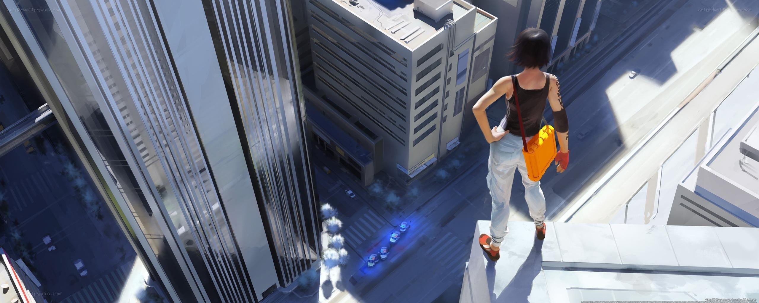 person on rooftop overlooking city