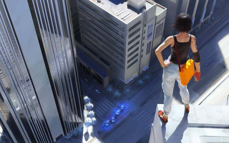 person on rooftop overlooking city