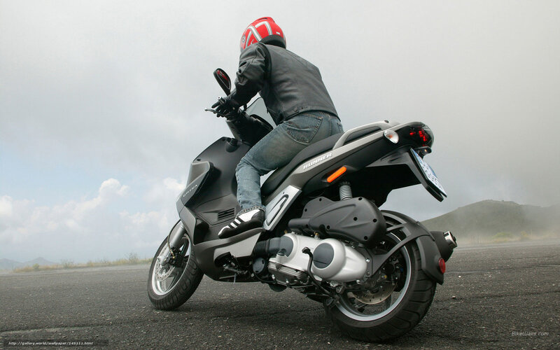 Person on scooter in fog