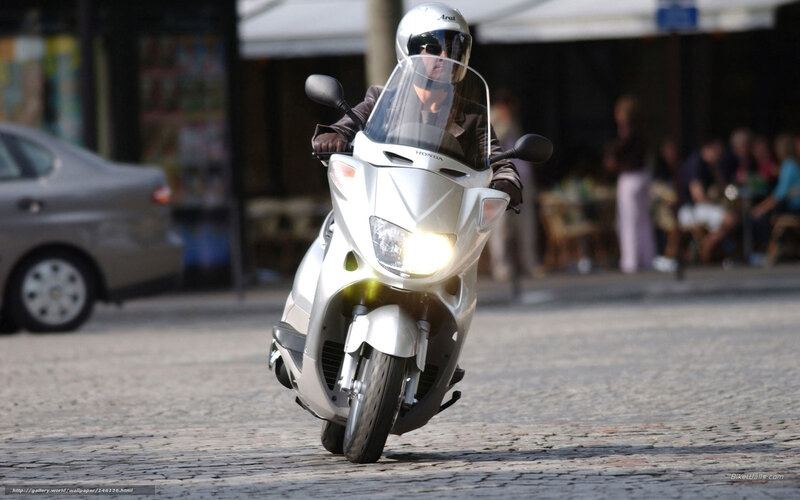 Person on Silver Scooter