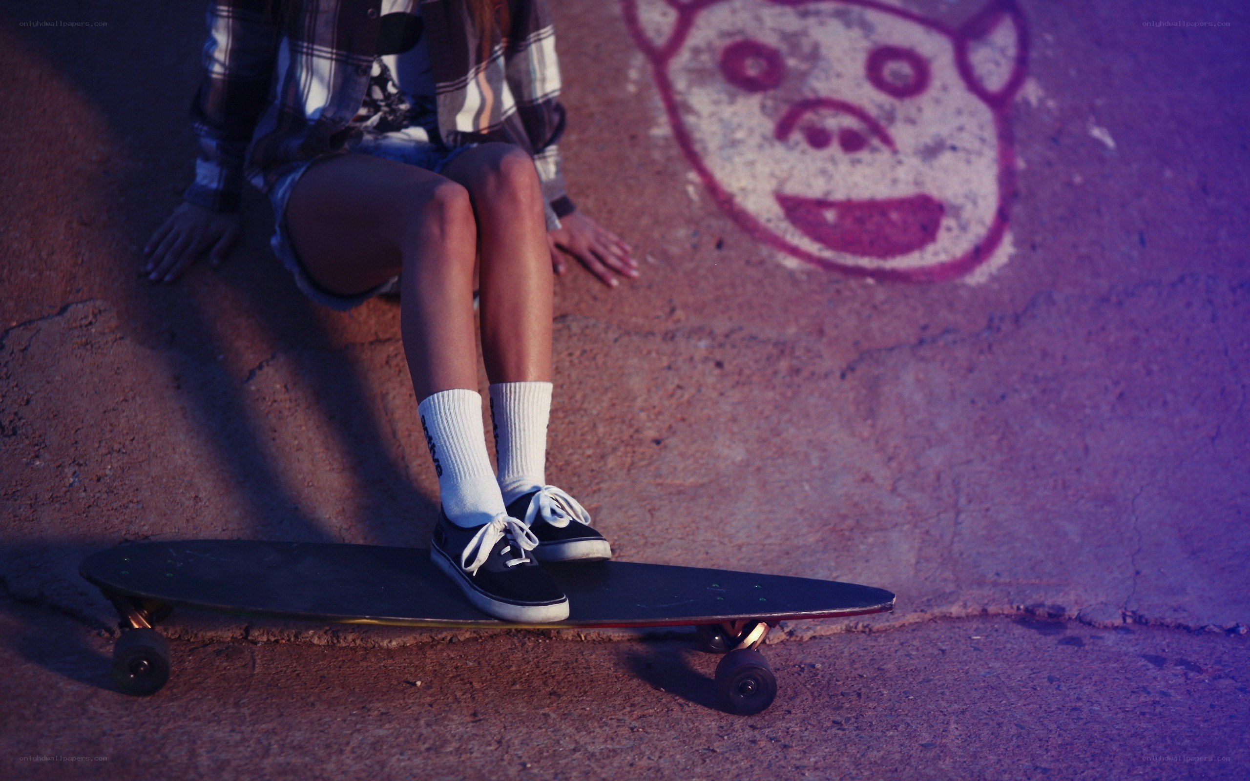 Person on skateboard with graffiti