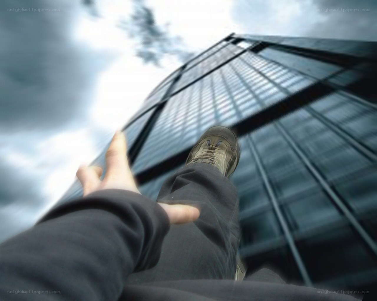 Person on skyscraper edge