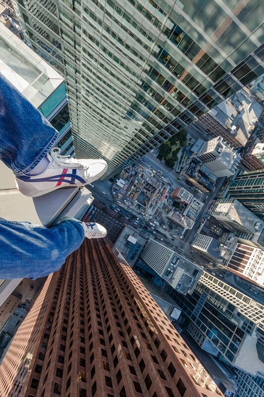 person on skyscraper edge