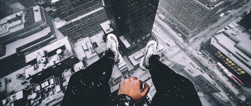 Person on Skyscraper Edge — Black, Dramatic, Winter