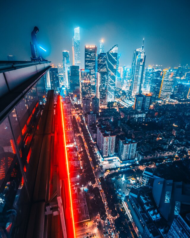 Person on Skyscraper Edge — Blue, Dramatic, Night