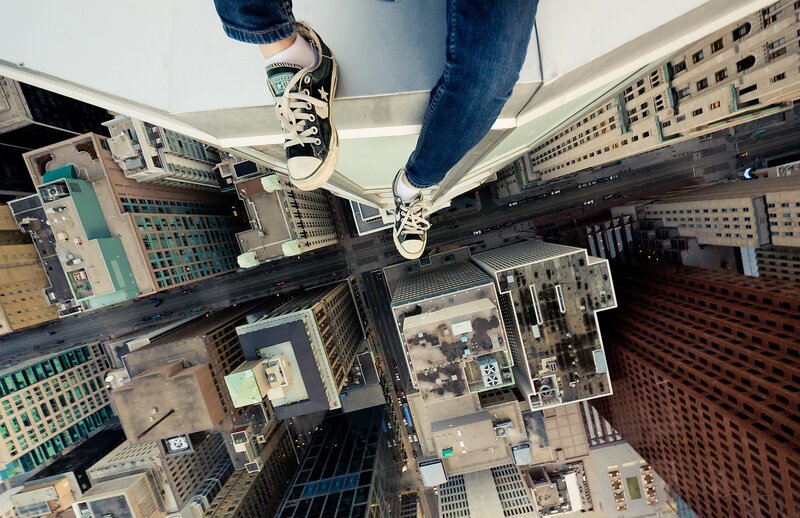 Person on Skyscraper Edge — Blue, Dramatic