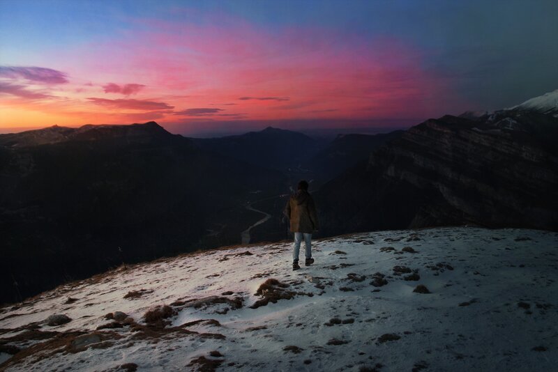 Person on Snowy Mountain — Pink, Dramatic