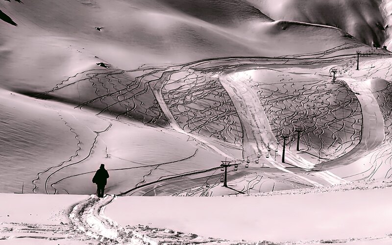 person on snowy mountain slope