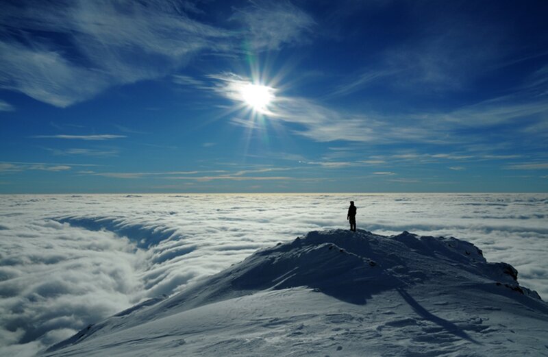 Person on Snowy Peak