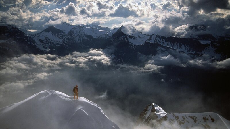 Person on Snowy Peak — White, Dramatic
