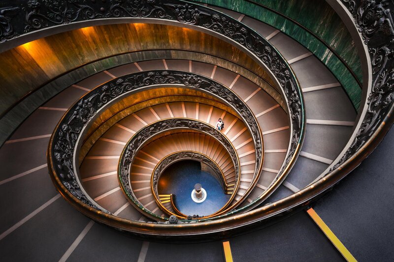 Person on Spiral Staircase — Brown