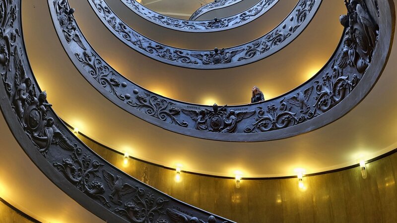 Person on Spiral Staircase — Yellow