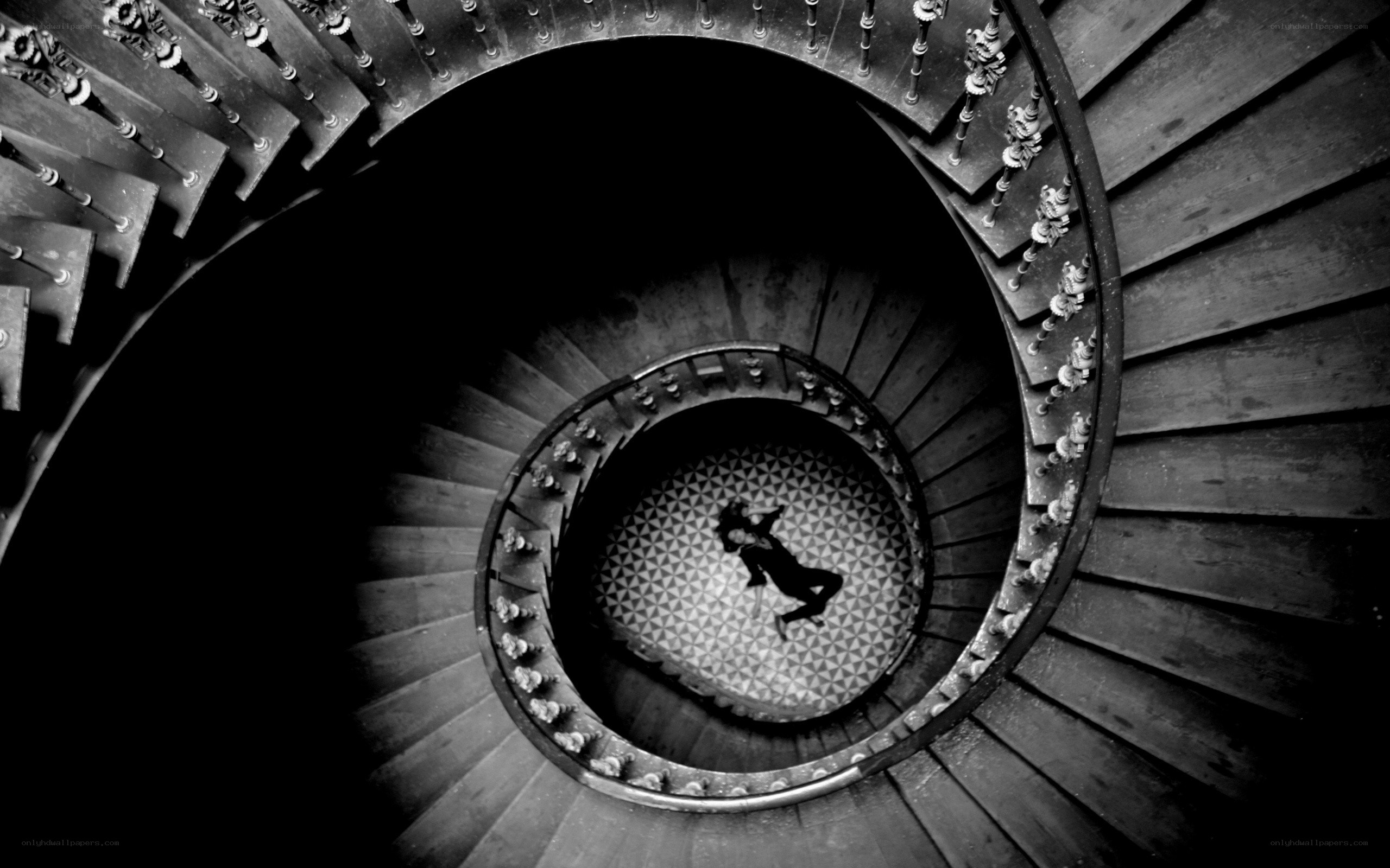 person on spiral staircase