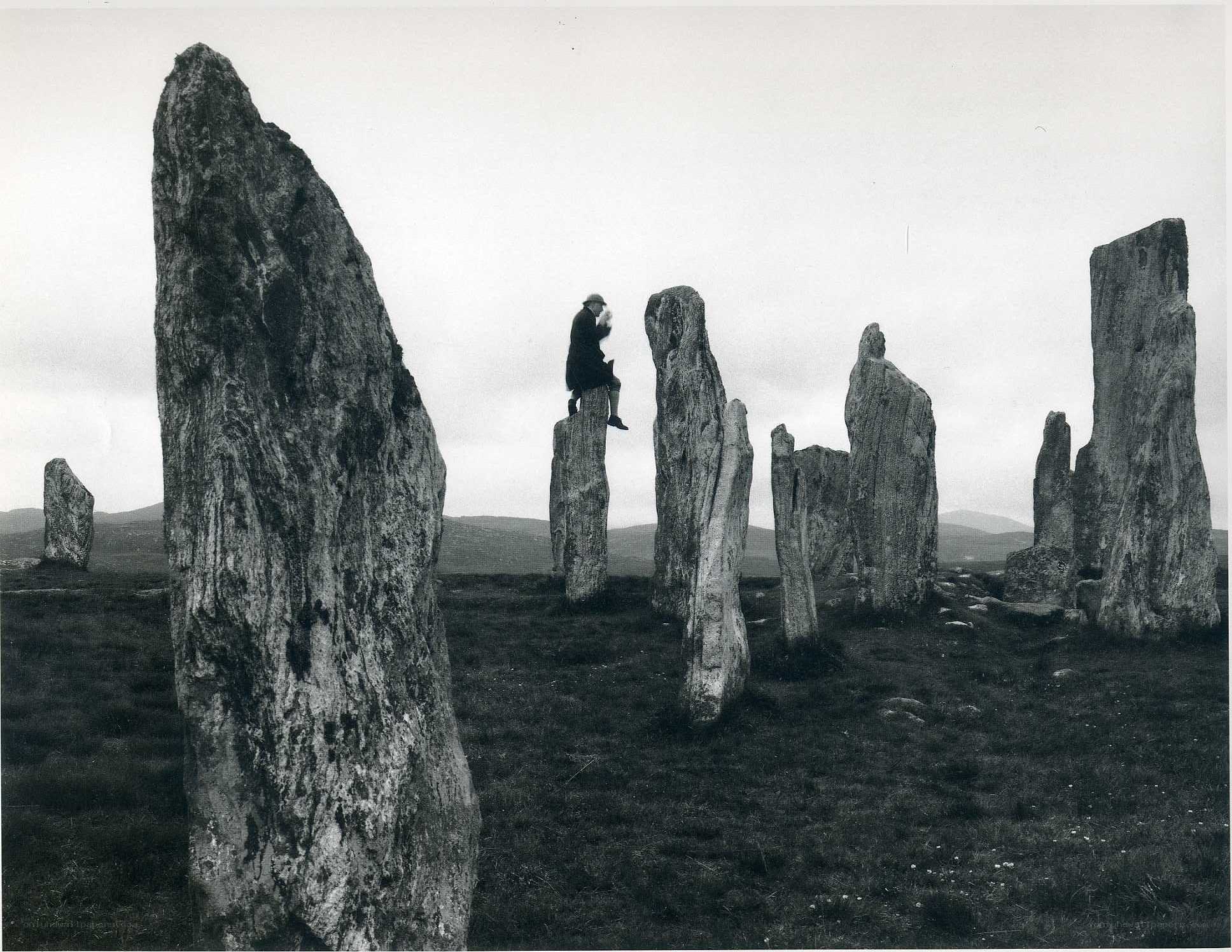 Person on stone monument