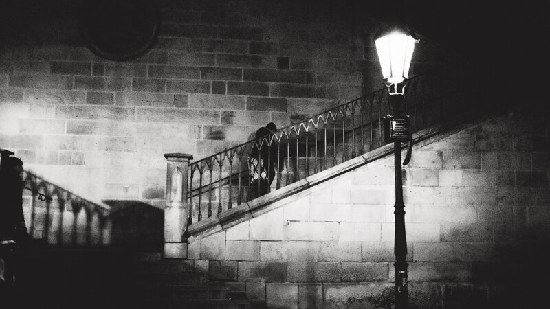 Person on Stone Stairs — Black