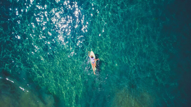Person on Surfboard — Blue, Serene, Afternoon