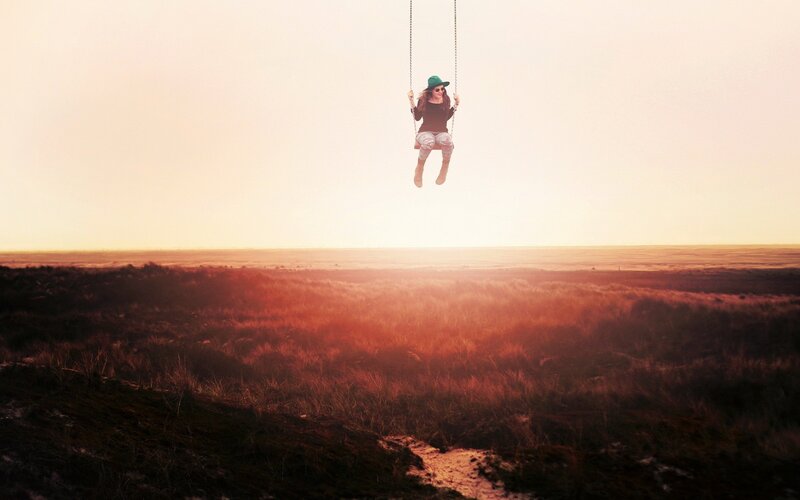 Person on Swing — Orange, Serene, Sunset